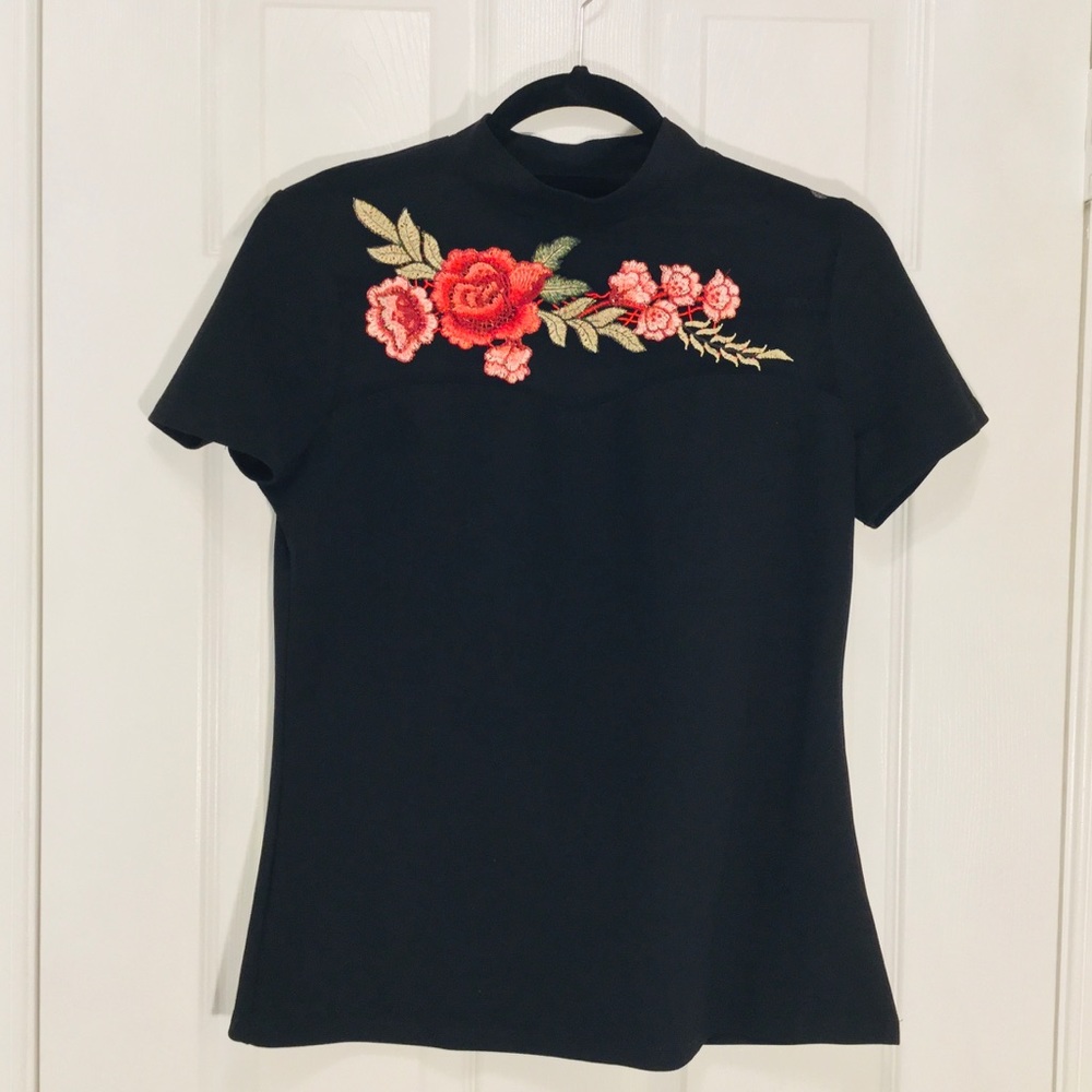Black top with Embroidery. Size M